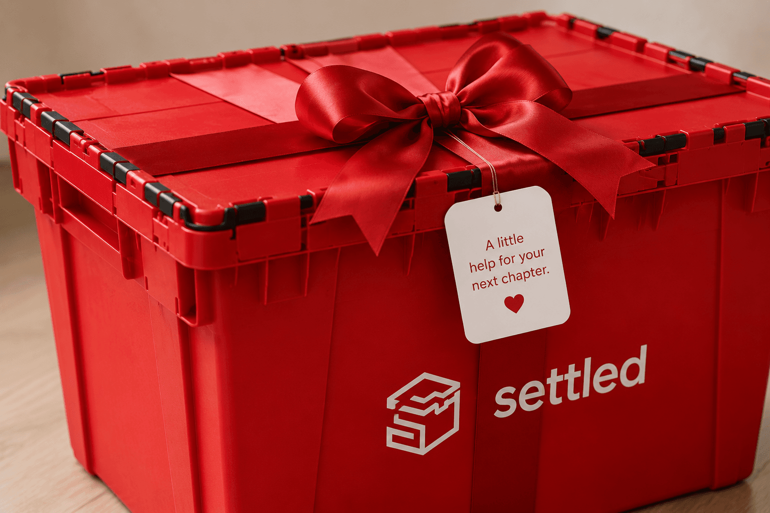 A Settled bin tied with a red ribbon and a closing-gift tag